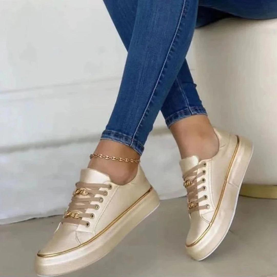 Elegante Damen-Sneaker mit goldenen Akzenten